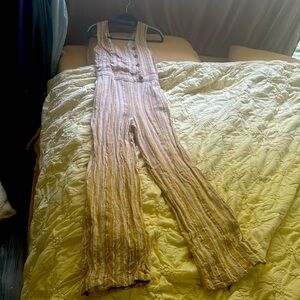 Long jumper with open back on the top.